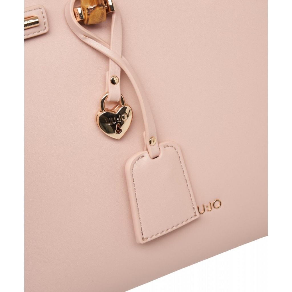 Borsa a mano con Charm rosa antico